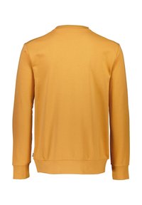 Felpa gialla con maniche lunghe, colletto rotondo e polsini a costine. Tessuto liscio con una vestibilità comoda e orlo inferiore leggermente svasato.