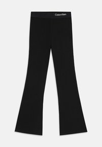 Pantalons évasés noirs en tissu côtelé avec une taille logotée. Le design comprend un haut ajusté et un bas évasé.