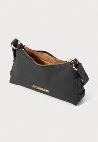 Black Love Moschino shoulder bag with gold zipper, gold logo, adjustable strap, and brown suede interior lining.