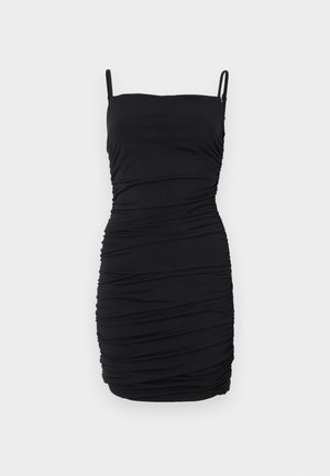 Black sleeveless dress made of stretchy fabric, featuring a ruched design throughout, with adjustable spaghetti straps and a fitted silhouette.