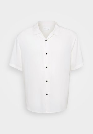 White short-sleeve shirt featuring a collared neckline and five black buttons down the front, with a smooth, lightweight fabric texture.