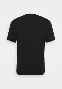 T-shirt noir uni à manches courtes et col rond, vu de dos sur fond blanc.