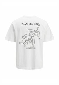 Hvid bomulds t-shirt med en sort stregtegning af et blad og teksten "JUAN-LES-PINS" på ryggen. Casual pasform, korte ærmer.