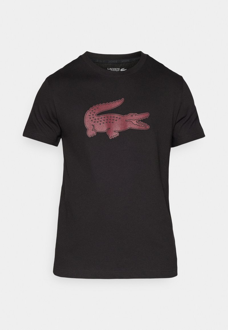 T-shirt en coton noir avec un grand motif de crocodile brodé bordeaux sur le devant. Manches courtes et encolure ras du cou.