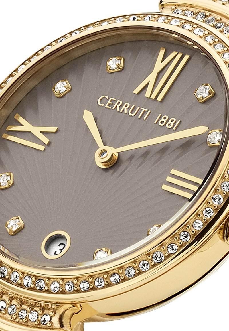 Orologio Cerruti 1881 con quadrante grigio, rifiniture dorate, indicatori in cristallo e decorazioni a pois. Presenta numeri romani e lancette delle ore e dei minuti intricate.