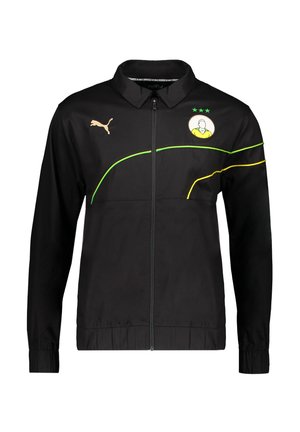 Zwarte zip-up jas met kraag, met een geel en groen ontwerp, Puma-logo in goud en een grafisch embleem op de borst.