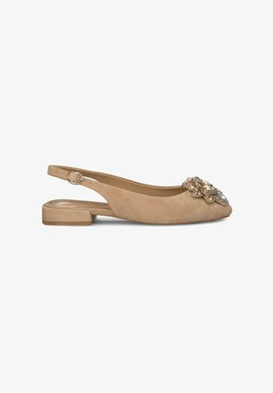 Beige suede slingback shoe with a rounded toe, low block heel, and decorative floral embellishment on the front. Smooth texture throughout.