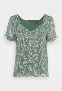 Grön kortärmad blus med vita oregelbundna prickar, volangärmar, knappar fram och rundad halsringning.