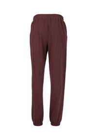 Bordeauxfarbene Jogginghose mit elastischem Bund und Bündchen, aus weichem Stoff, mit lockerer Passform und zwei seitlichen Taschen.