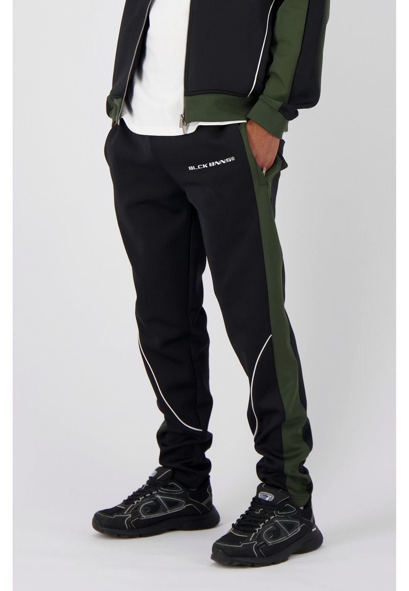 Black Bananas PANELV2 Tracksuit bottoms moss green/evergreen Zalando