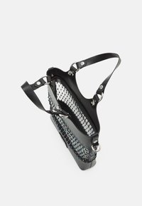 Black bag featuring a mesh design with multicolored beading, sturdy leather trim, and adjustable straps for versatile carrying options.