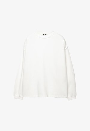 Dugi rukav bijeli dukserica od pamuka. Ima okrugli izrez, spuštena ramena i rebraste manžetne. Glatka tekstura bez uzoraka.