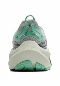 Running shoe with a grey mesh upper, mint green accents, pronounced heel shape, and textured white outsole with green traction lugs.