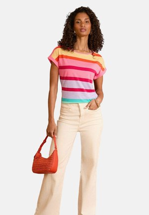 Short-sleeve, multi-colored striped top in pink, orange, and blue, paired with cream wide-leg pants and a textured red handbag.