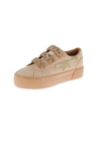 Beige sneakers with a smooth finish, featuring three Velcro straps and a gold lightning bolt accent. Textured tan sole.