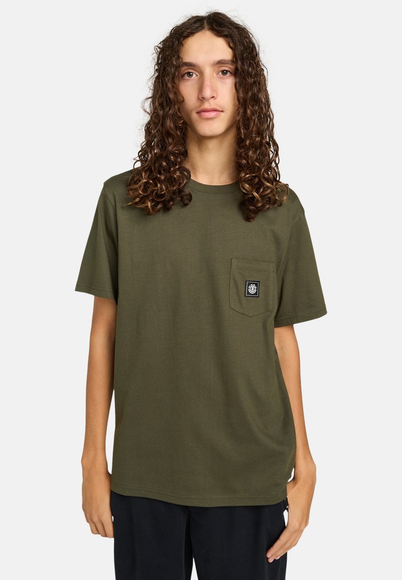 Olive green cotton T-shirt with a rounded neckline, short sleeves, and a front pocket featuring a black logo patch. Smooth texture.
