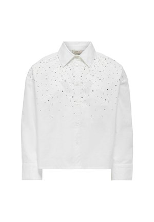 Chemise en coton blanc avec un col et des clous en argent le long des épaules et de la partie supérieure avant. Manches longues avec des poignets à boutons.