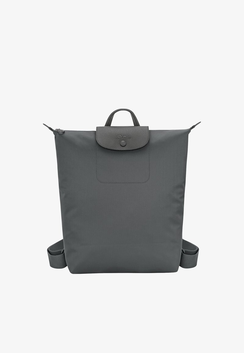 Dark gray, square-shaped backpack with a top handle, flap closure with button, and adjustable shoulder straps visible on sides.