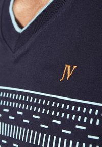 Navy knitted sweater featuring a V-neckline, light blue accents, and an orange "JV" logo with a geometric pattern in lighter blue.