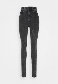 Jeans skinny de tiro alto en negro con efecto acid-wash, con cierre de botones y bolsillos frontales, exhibidos sobre un fondo blanco liso.