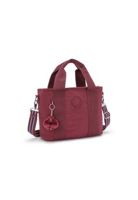 Borsa a spalla in tessuto rosso con doppi manici, tracolla regolabile a strisce e un portachiavi a forma di scimmia in peluche staccabile.