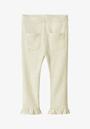 Leggings en crème côtelés avec un ourlet à volants, dotés de deux poches arrière et d'une taille élastique pour le confort. Tissu texturé doux.