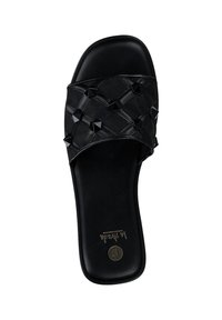 Black slide sandal with a woven fabric upper adorned with pyramid studs. Smooth black sole with embossed logo. Flat design for comfort.