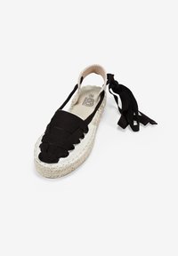 Espadrillas nere con toma in tessuto intrecciato, suola in juta e lacci alla caviglia. Presentano una punta rotonda e una finitura testurizzata. Taglia 36.