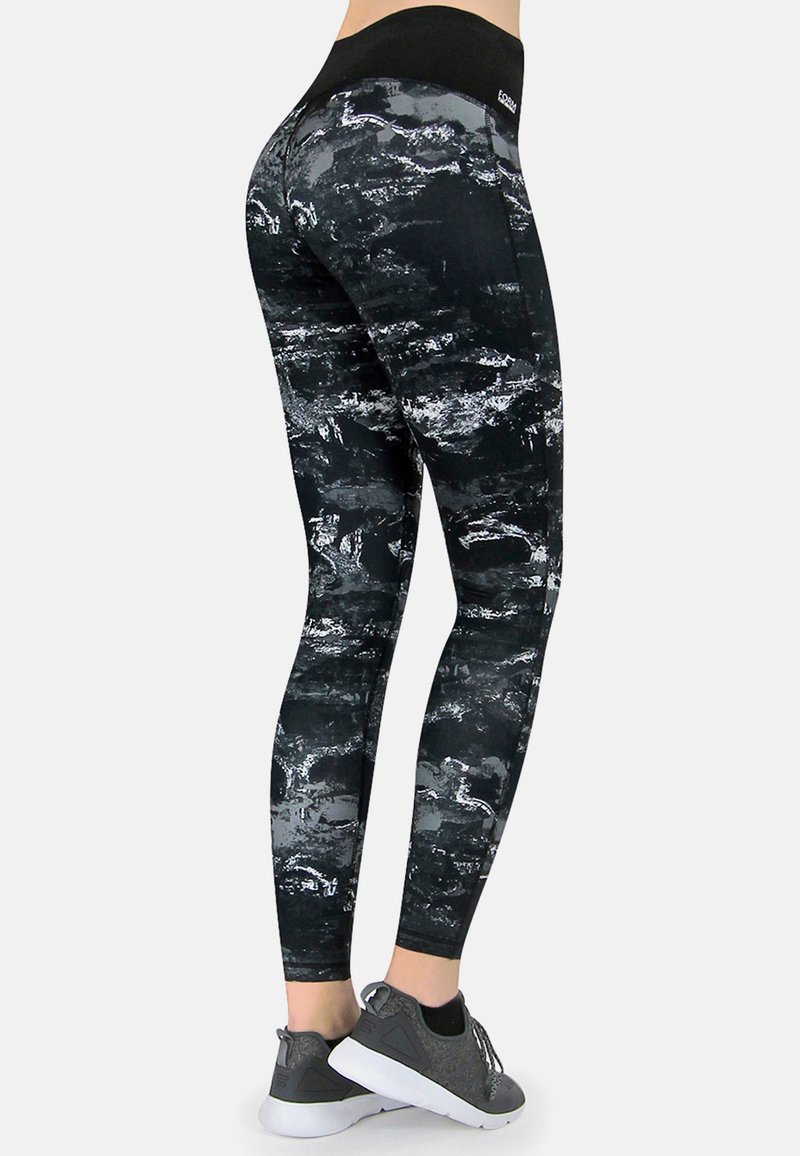 Schwarze und graue leggings mit einem hohen Bund, aus dehnbarem Material, mit abstrakten Texturen und einer eng anliegenden Passform.