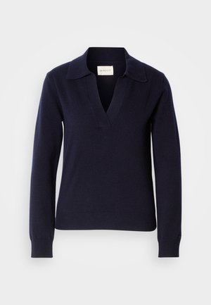 Maglione in maglia di colore blu navy con scollo a V e colletto, dotato di maniche lunghe e polsini e orlo a coste. Etichetta del marchio visibile all'interno.