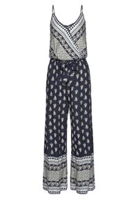 Marinblå mönstrad jumpsuit med ärmlös överdel, vida byxor och ett tygbälte. Har olika blommönster och kontrasterande detaljer.