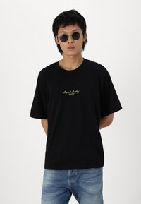 Jack & Jones JORREALMEAL TEE UNISEX - Μπλουζάκι με στάμπα - black