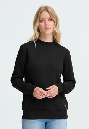 Sweatshirt en coton noir avec un col rond, des poignets et un ourlet côtelés. Présente un petit logo marron sur le bas à gauche. Design uni.