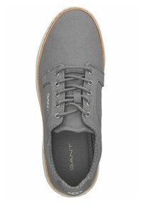 Gray canvas sneaker with round toe, lace-up front, and rubber sole. Features light brown accents and a subtle logo on the side.