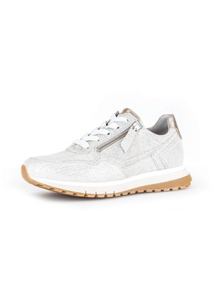 White textured sneaker with white laces, side zipper, metallic gold accents, and a white sole with a light brown tread.