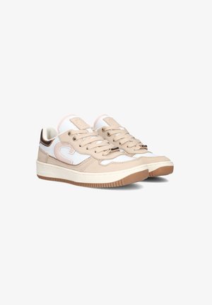 Beige sports shoes with white accents, featuring a textured synthetic upper, round toe, and tonal laces. Rubber sole with a patterned grip.