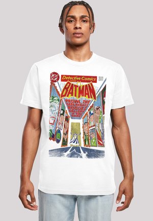 White cotton T-shirt featuring a comic book design with colorful graphics, including the text "Detective Comics" and imagery of Batman.