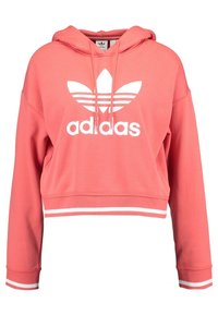Korálová zkrácená mikina s kapucí a bílým logem Adidas a třemi pruhy na hrudi. Bílé pruhy na manžetách a lemu. Měkký materiál.