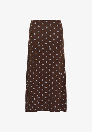 Smeđa suknja srednje dužine s svijetloplavim točkicama i asimetričnim šavom na jednobojnoj pozadini.