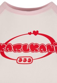 Short-sleeve, light beige T-shirt with pink collar, featuring red "KARL KANI" logo and heart accents in a playful, rounded font.