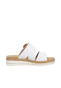 White leather slide sandals with two wide, crisscross straps. Features a low, espadrille-style wedge sole with textured edges.