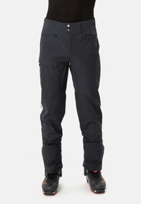 Pantalons de ski imperméables en gris foncé, dotés d'un design épuré, de plusieurs poches, d'accents zippés et d'un ourlet inférieur renforcé pour plus de durabilité.