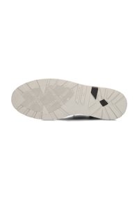 Witte sneakersole met een gemarmerd grippatroon. Inclusief een zwart accent bij de hak. Stevig rubbermateriaal met een lichte kromming in de vorm.