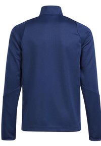 Casaco de manga longa azul-marinho com colarinho alto, textura suave e costuras pronunciadas nos ombros e lados. Design simples, sem logotipos visíveis.