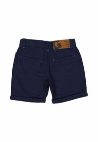 Mörkblå shorts med en vikt fåll, två bakfickor och en brun läderlapp på midjan med präglad text.