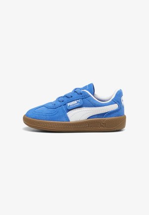 Blue suede sneaker with white accents and lace-up design. Features a textured gum rubber sole and PUMA logo on the side.