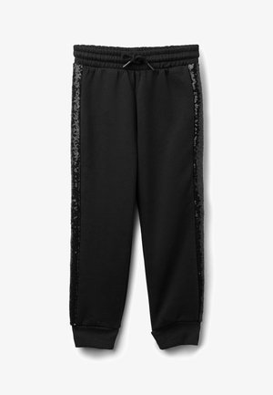 Pantalons de survêtement noirs avec une taille élastique, présentant des panneaux latéraux en sequins noirs brillants et des poignets élastiques aux chevilles.