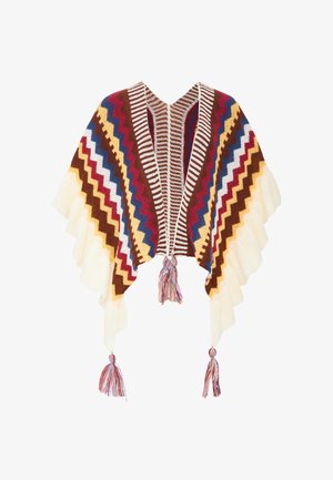 Dzianinowy poncho w zygzakowy wzór w odcieniach brązu, kremu, czerwieni, niebieskiego i żółtego. Frędzle na krawędziach i pompony w dolnych rogach.