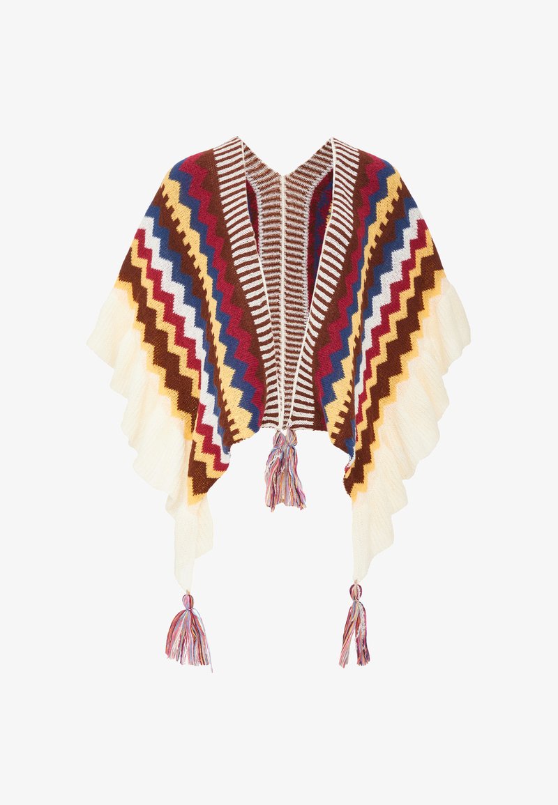 Gestrickter Poncho mit Zickzackmuster in Braun, Creme, Rot, Blau und Gelb. Fransen an den Kanten und Quasten an den unteren Ecken.