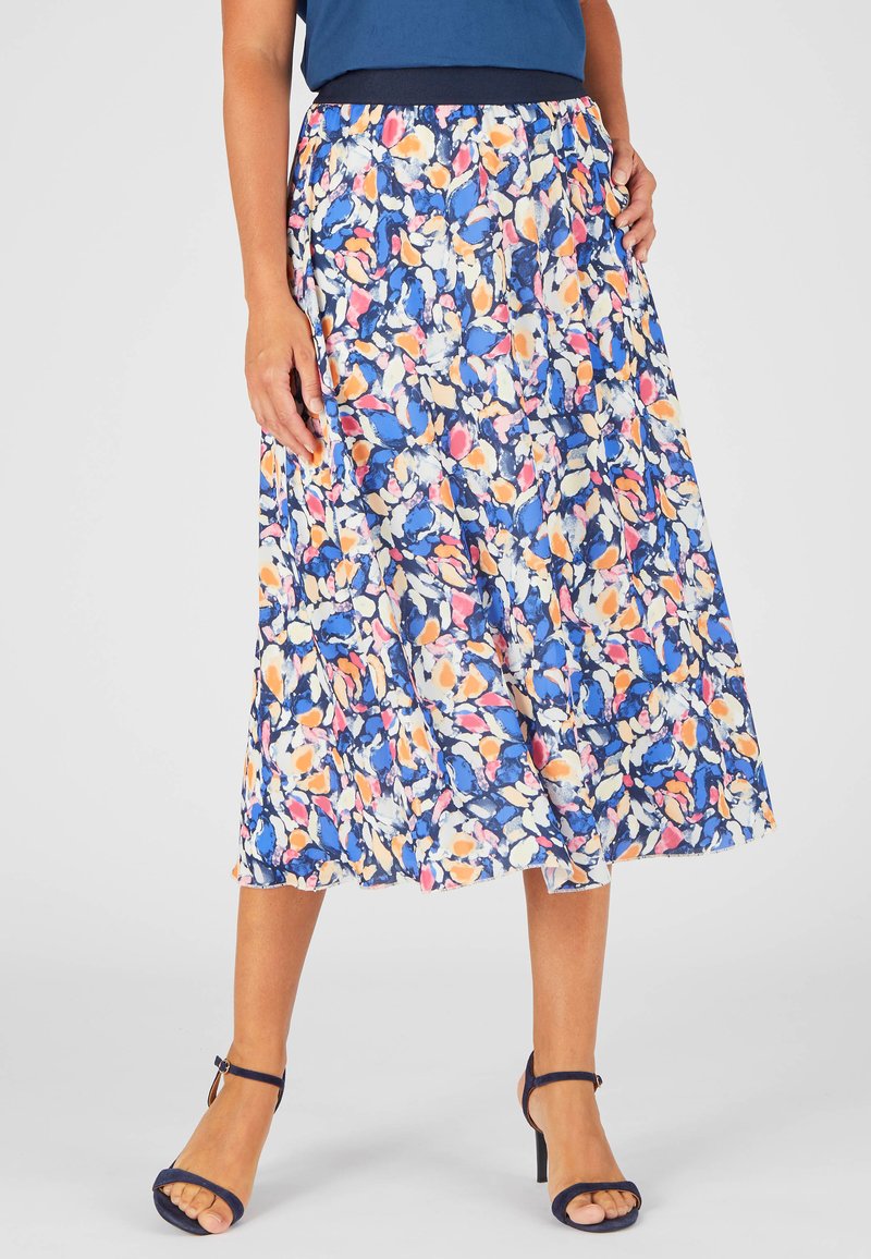 Falda midi floral con una cintura ajustada, en un fondo azul marino con patrones abstractos en azul, melocotón y blanco. Tejido ligero y fluido.